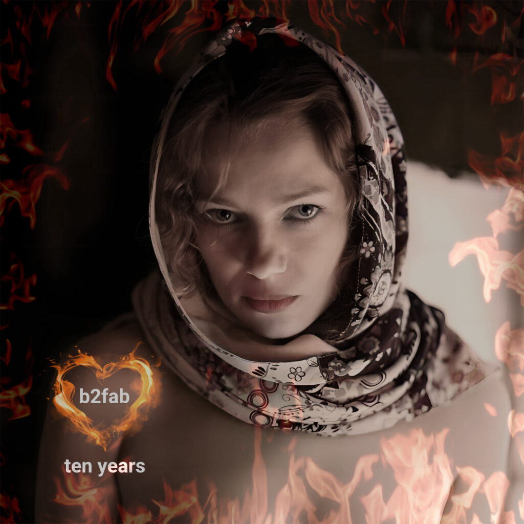 Ten Years album cover. A girl with a slavic shawl, flames and a fierce look