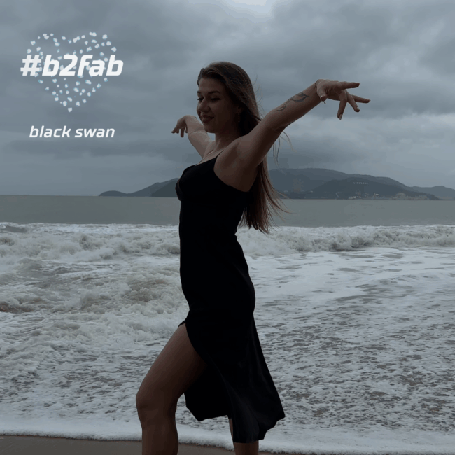 Black Swan Cover. Lisa on the Nha Trang beach in Vietnam, posing as a black swan in a black dress