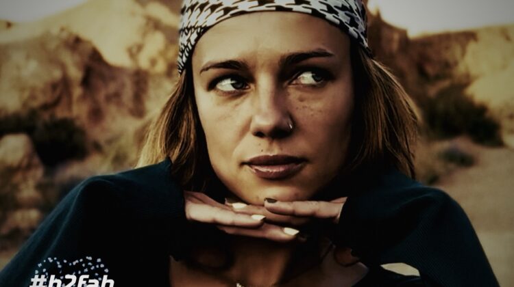 A confident girl against the background of mountains in Kychizistan